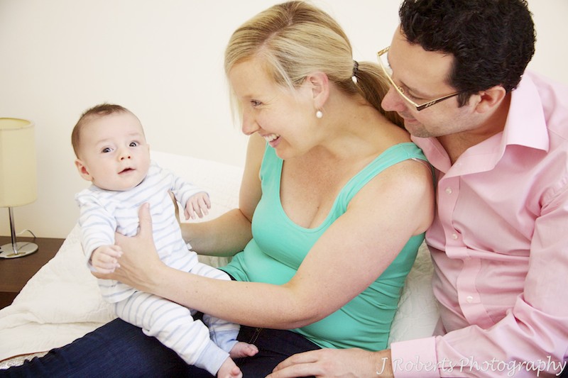 Mum and Dad smiling at baby boy - baby portrait photography sydney